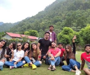 Friends enjoying a group getaway with camping, outdoor games, and adventure activities in a beautiful natural setting.